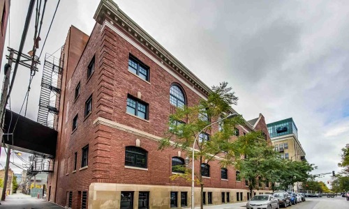 west loop street scene with historic brick buildings and modern high-rises