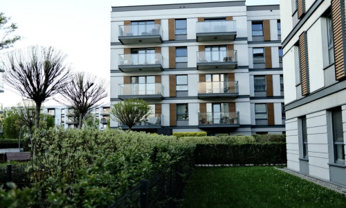Apartments with community garden lush urban raised beds greenery - Apartments with community garden