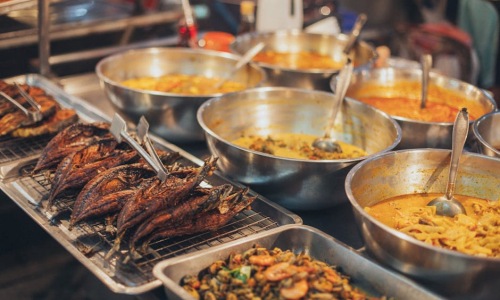 vibrant spread of various Thai dishes - best thai food